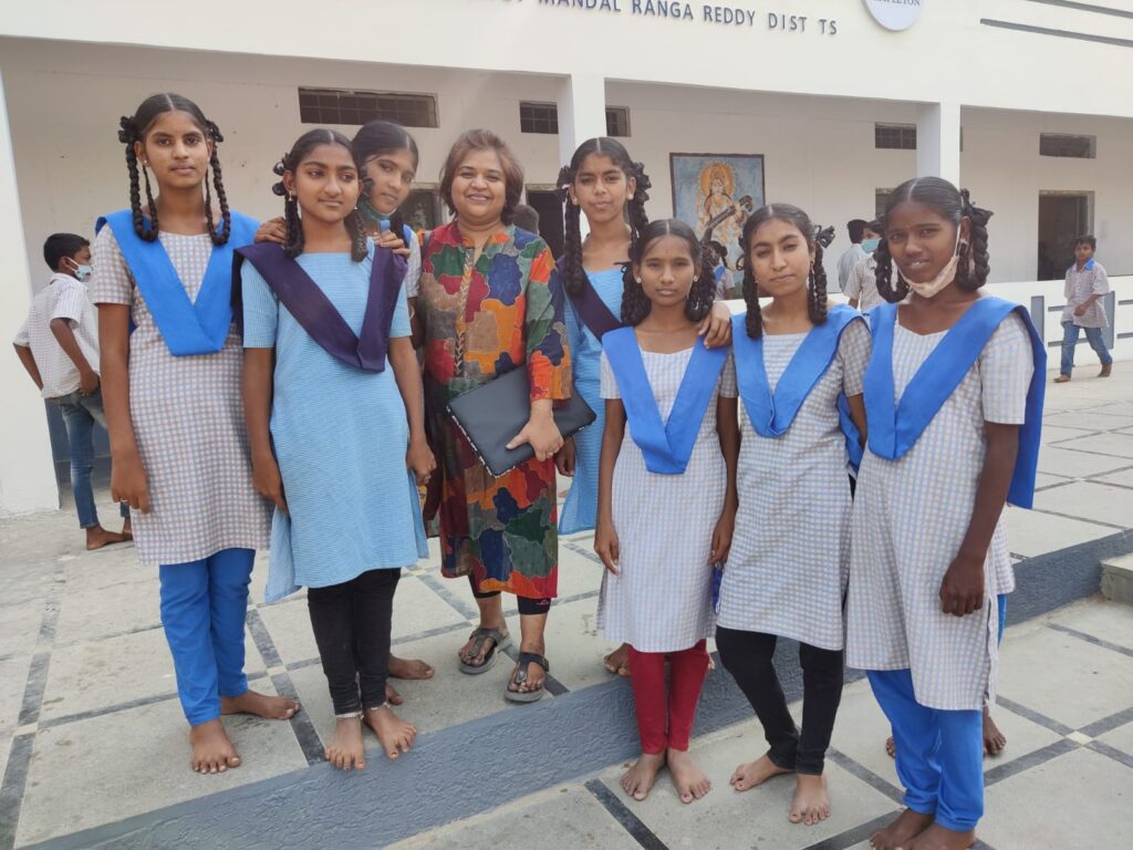 Photo: Kaagitham foundation member with school children